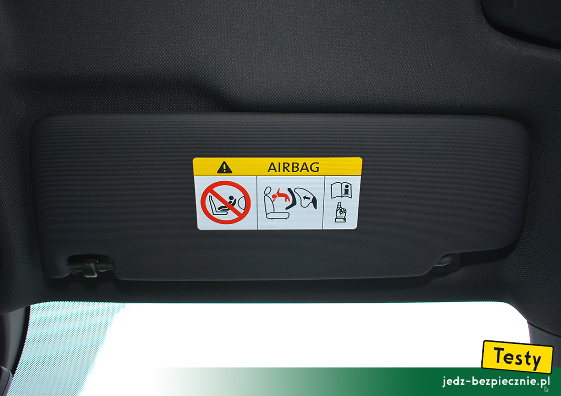 Testy - Cupra Formentor - ostrzeżenie na osłonie przeciwsłonecznej pasażera - fotelik tyłem do kierunku jazdy