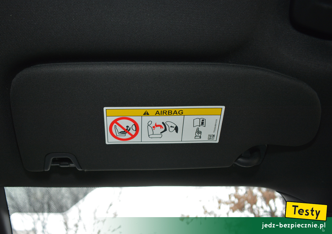 Testy - Ford S-Max hybrid - ostrzeżenie na osłonie przeciwsłonecznej pasażera, fotelik dziecięcy tyłem do kierunku jazdy